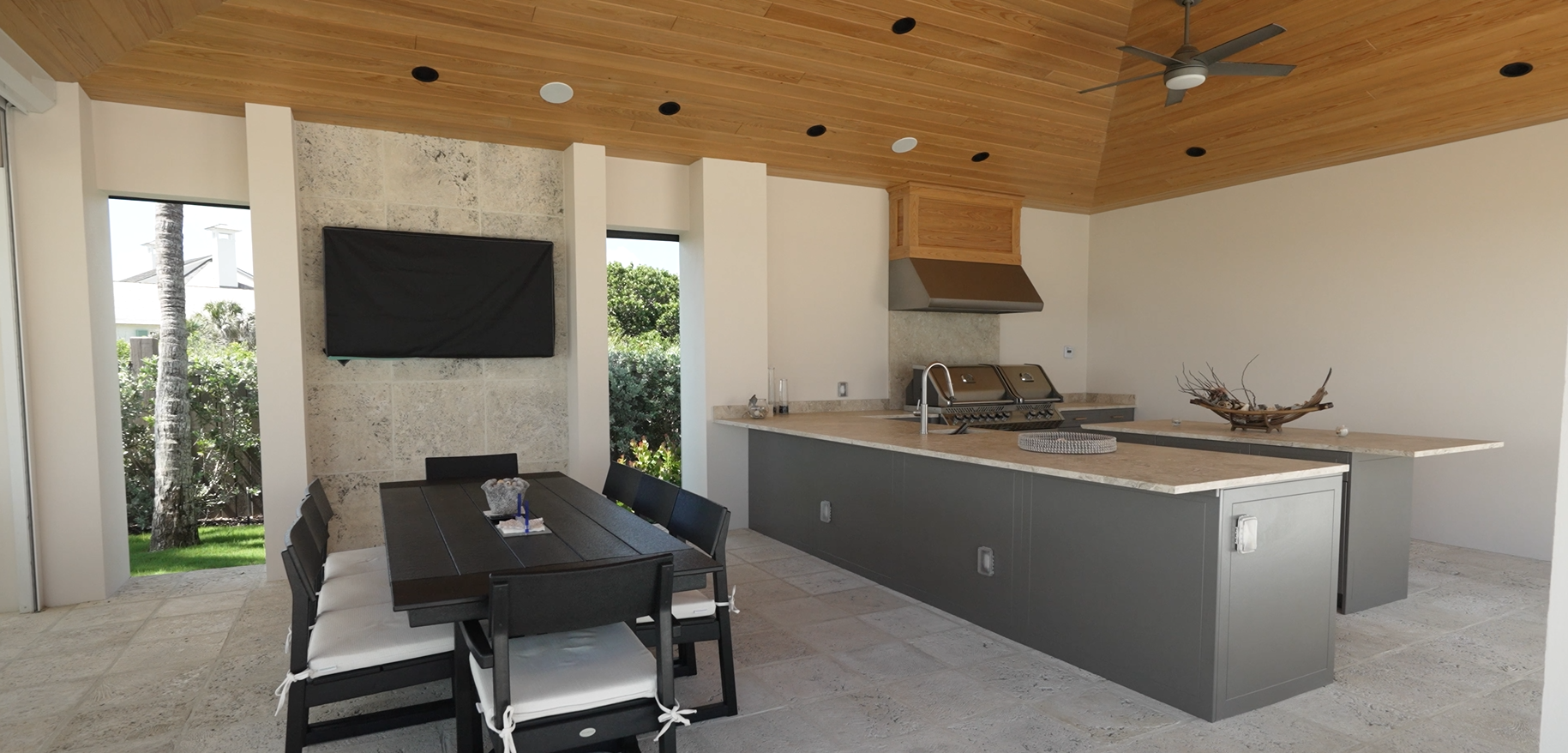 luxury home Vero Beach FL outdoor kitchen with grill seating and covered patio
