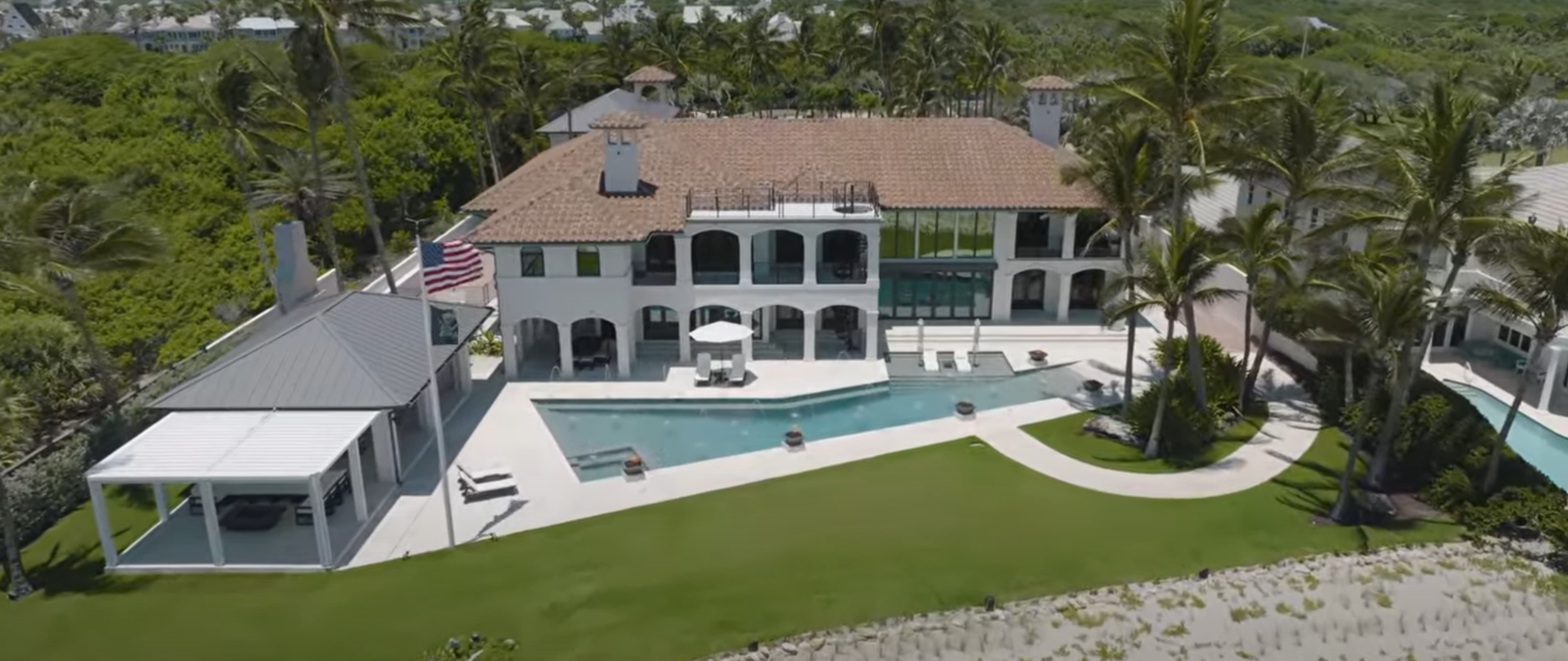 home renovation Vero Beach FL luxury waterfront estate with pool outdoor living space and palm trees