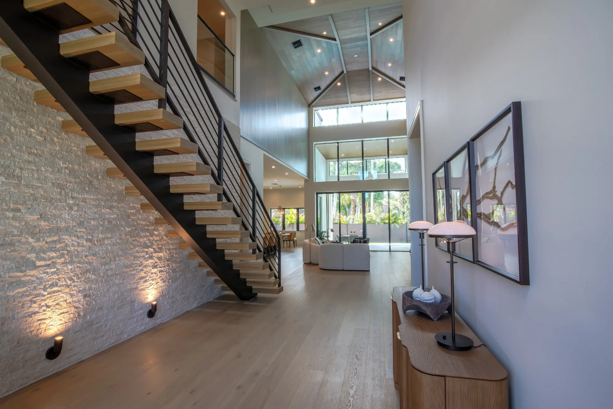 Modern home entry with floating staircase and high ceilings in Vero Beach FL<br />
