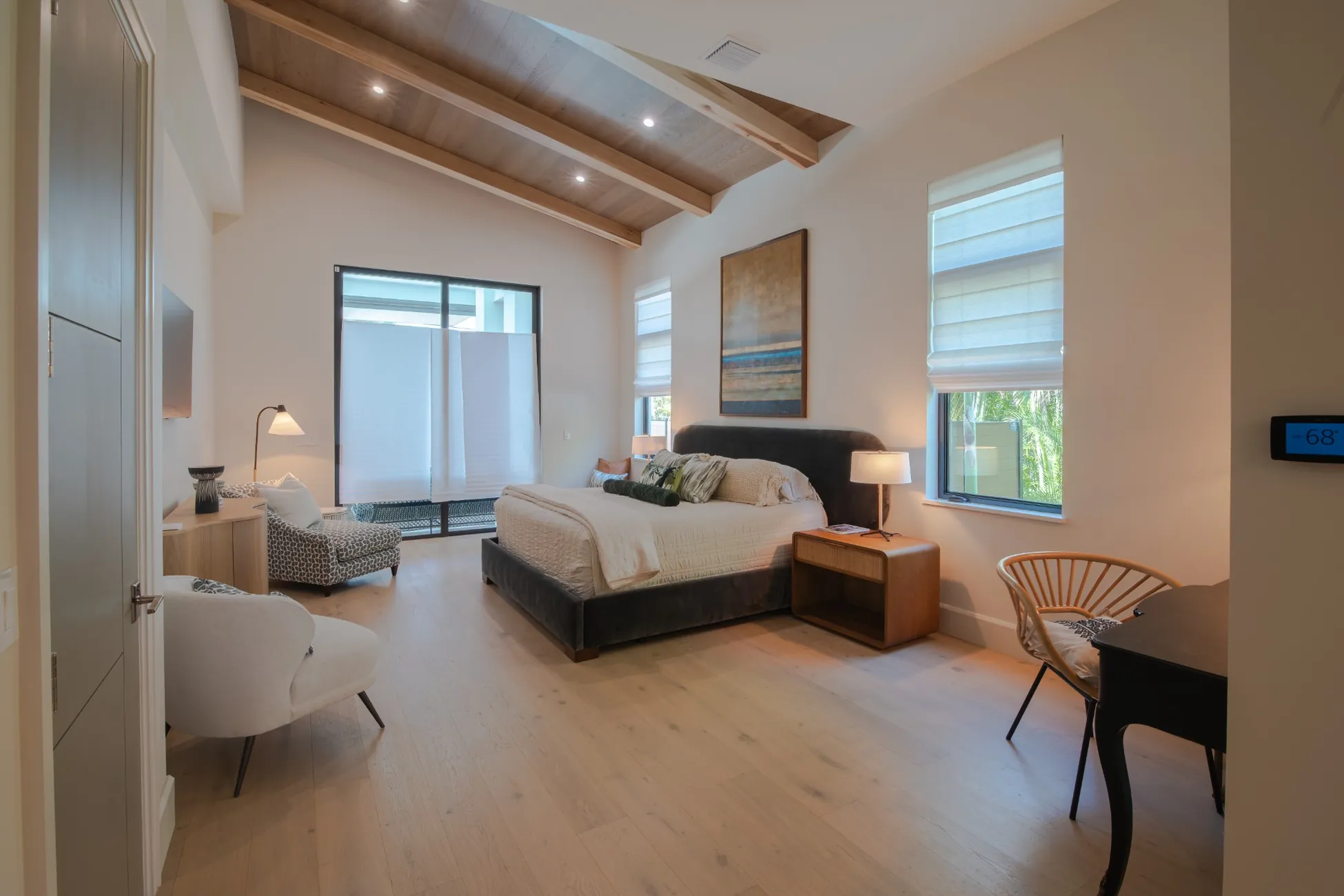 Modern bedroom with vaulted wood ceiling in custom home in Vero Beach FL