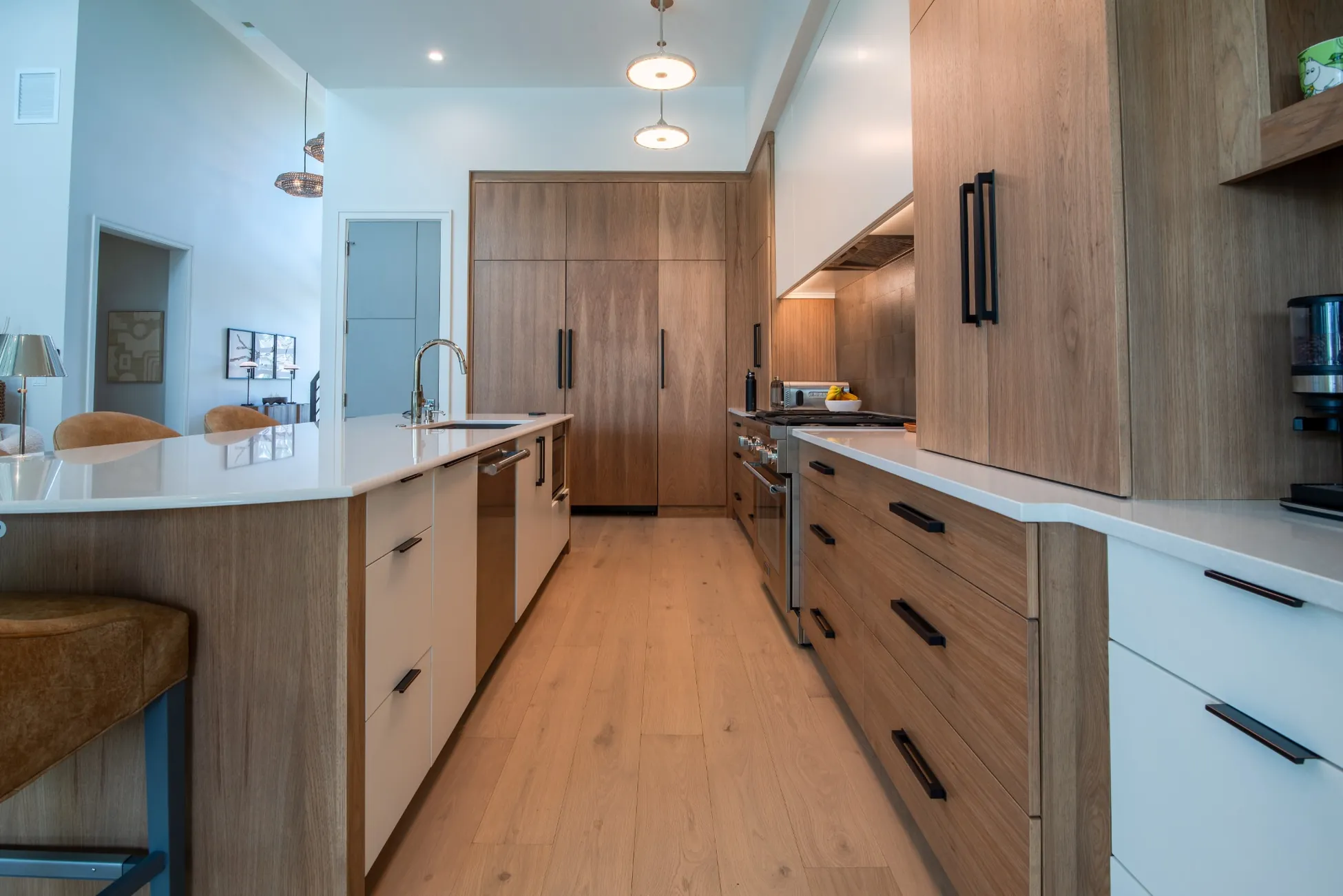Modern galley kitchen with custom cabinetry and island in custom home in Vero Beach FL<br />
