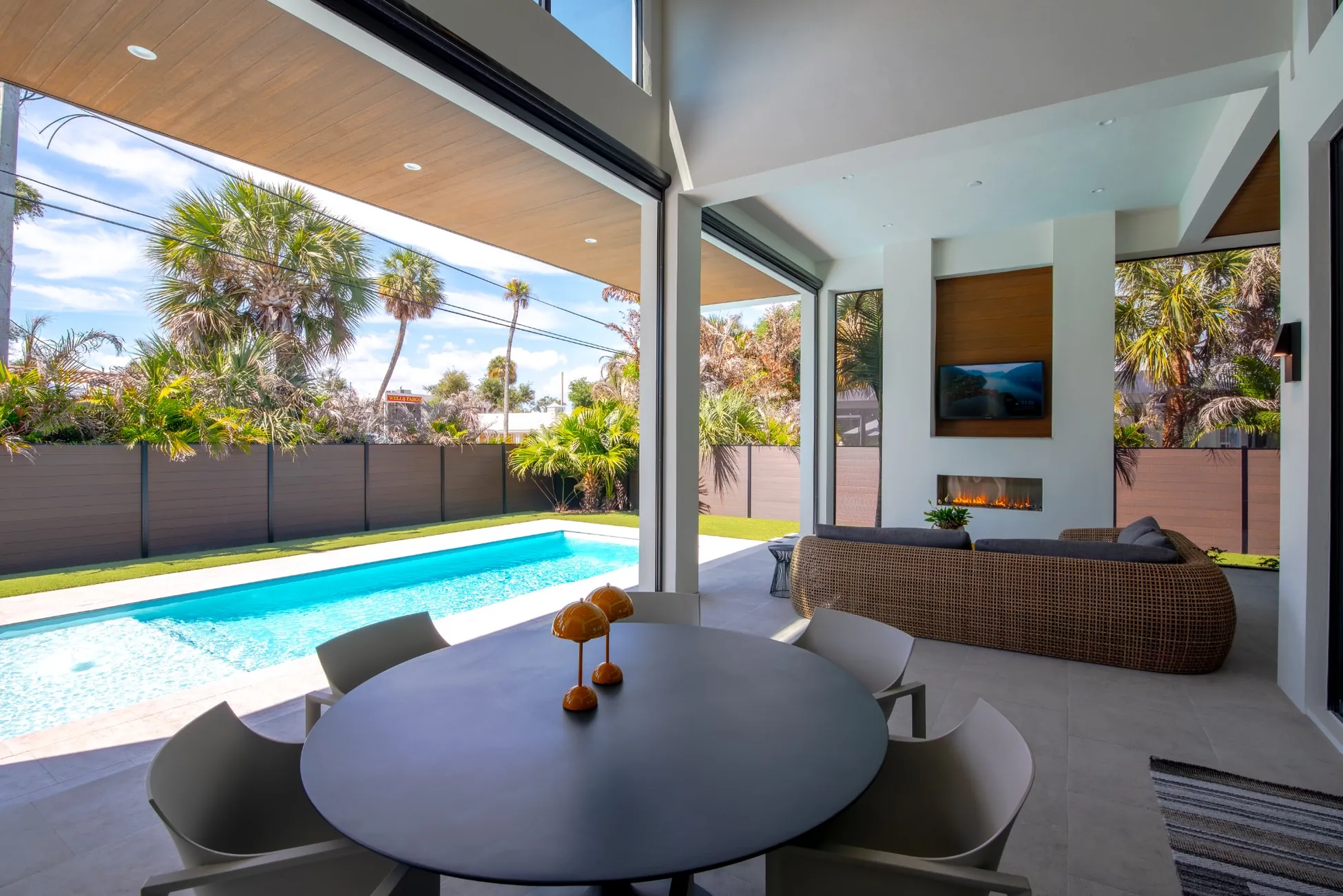 Luxury modern custom home with pool and covered patio outdoor living space in Vero Beach FL<br />
