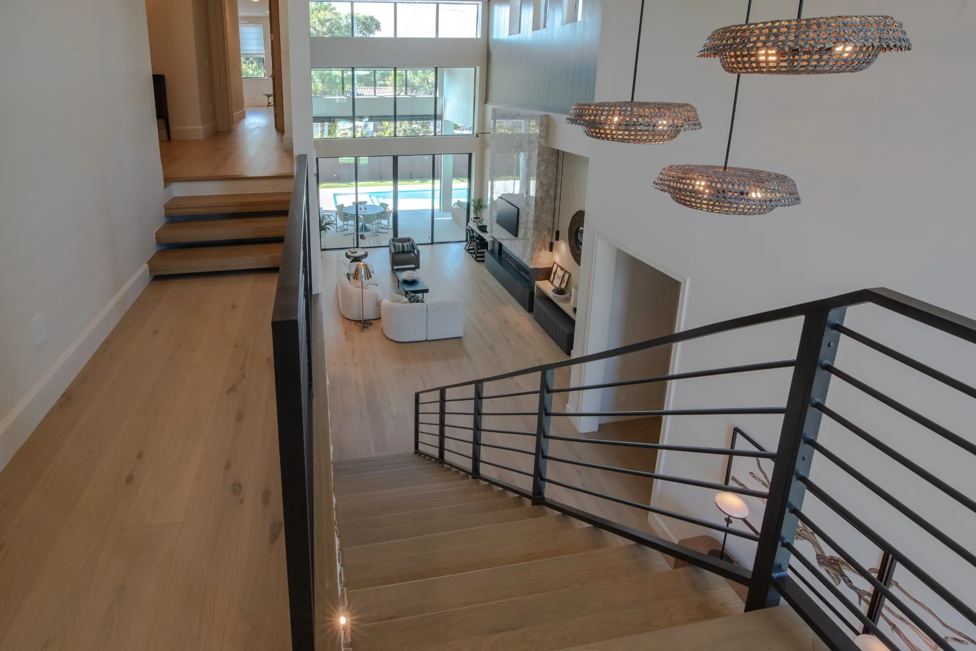 Second floor overlook of open living room in modern custom home in Vero Beach FL<br />
