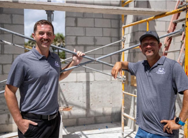 Brian Neu and Jesse Guthre, owners and partners of Island Harbor Custom Builders, onsite at a luxury residential construction project in Vero Beach.